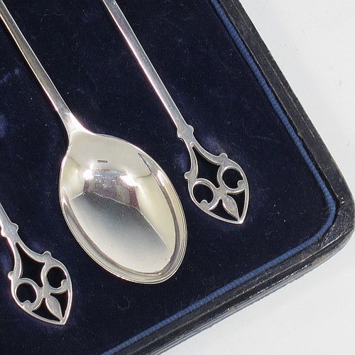 A pretty Sterling Silver set of six tea or coffee spoons, having plain oval bowls and hand-pierced Fleur-de-Lis style handles, all fitted into their original cream satin and dark blue velvet-lined presentation box. Made by Mappin and Webb of Birmingham in 1925. The dimensions of this fine hand-made set of teaspoons or coffee spoons are length of each spoon 11 cms (4.3 inches), with a total weight of approx. 55g (1.8 troy ounces).    