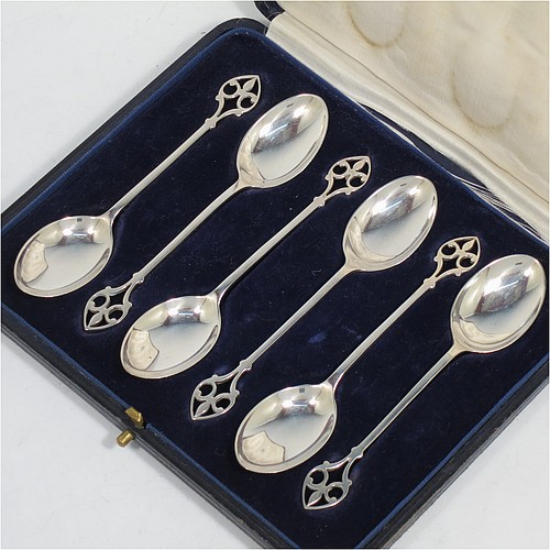 A pretty Sterling Silver set of six tea or coffee spoons, having plain oval bowls and hand-pierced Fleur-de-Lis style handles, all fitted into their original cream satin and dark blue velvet-lined presentation box. Made by Mappin and Webb of Birmingham in 1925. The dimensions of this fine hand-made set of teaspoons or coffee spoons are length of each spoon 11 cms (4.3 inches), with a total weight of approx. 55g (1.8 troy ounces).    