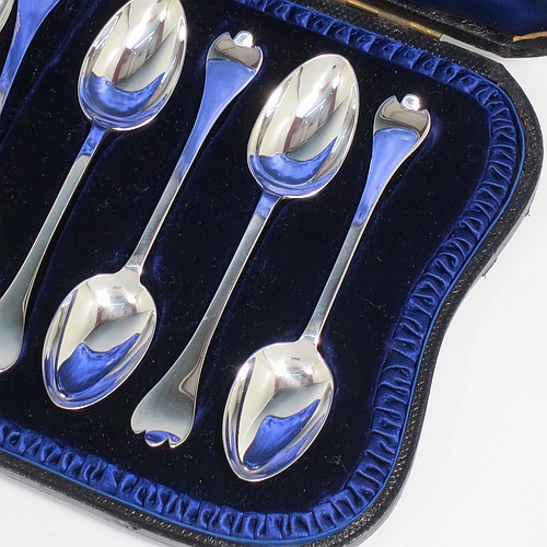 An Antique Victorian Sterling Silver set of 12 teaspoons and sugar nips in the Trefid End pattern, having plain oval bowls and handles, all in their original dark blue satin and velvet-lined presentation box. Made by Jackson and Fullerton of London in 1900. The dimensions of this fine hand-made antique silver set of sugar nips teaspoons are length of each spoon 11.5 cms (4.5 inches), and the total weight is approx. 159g (5 troy ounce).    