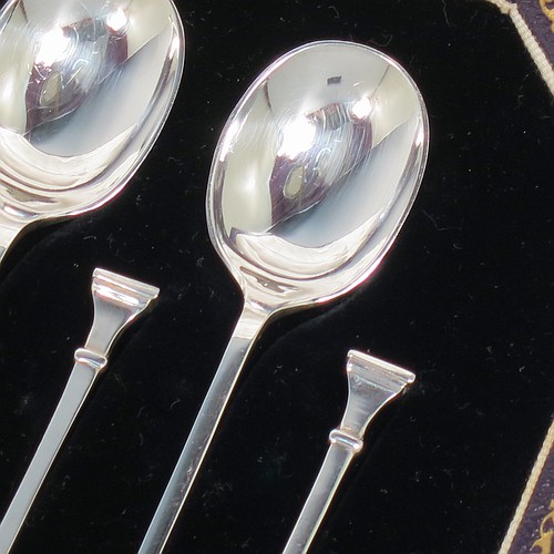 An Art Deco Sterling Silver set of 12 teaspoons or coffee spoons and sugar nips, having plain oval bowls, and handles in the Nail-End pattern, all in original cream satin and black velvet-lined presentation box. Made by the Cooper Brothers and Sons of Sheffield in 1923. The dimensions of this fine hand-made set of coffee spoons or teaspoons are length of each spoon 10 cms (4 inches), and the total weight is approx. 148g (4.8 troy ounce).    