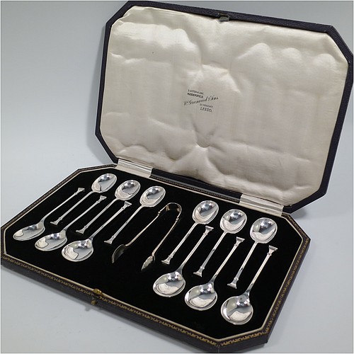 An Art Deco Sterling Silver set of 12 teaspoons or coffee spoons and sugar nips, having plain oval bowls, and handles in the Nail-End pattern, all in original cream satin and black velvet-lined presentation box. Made by the Cooper Brothers and Sons of Sheffield in 1923. The dimensions of this fine hand-made set of coffee spoons or teaspoons are length of each spoon 10 cms (4 inches), and the total weight is approx. 148g (4.8 troy ounce).    