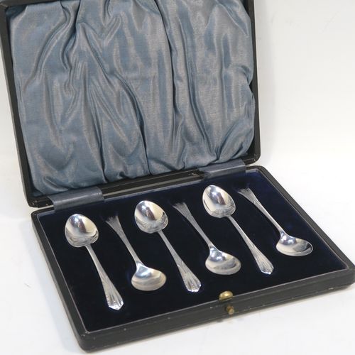 A very pretty Antique Sterling Silver set of six tea or coffee spoons, with hand-engraved floral and fluted decoration, and having plain oval bowls, all in their original light blue satin and dark blue velvet-lined presentation box. These beautiful antique silver spoons were made by W. S. Savage of Sheffield in 1911. The dimensions of this fine hand-made set of silver teaspoons or coffee spoons are length of each spoon 10 cms (4 inches), and the total weight is approx. 41g (1.3 troy ounces).  