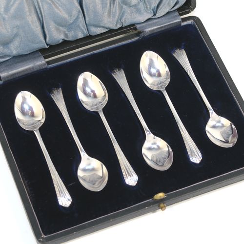 A very pretty Antique Sterling Silver set of six tea or coffee spoons, with hand-engraved floral and fluted decoration, and having plain oval bowls, all in their original light blue satin and dark blue velvet-lined presentation box. These beautiful antique silver spoons were made by W. S. Savage of Sheffield in 1911. The dimensions of this fine hand-made set of silver teaspoons or coffee spoons are length of each spoon 10 cms (4 inches), and the total weight is approx. 41g (1.3 troy ounces).  