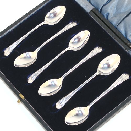 A very pretty Antique Sterling Silver set of six tea or coffee spoons, with hand-engraved floral and fluted decoration, and having plain oval bowls, all in their original light blue satin and dark blue velvet-lined presentation box. These beautiful antique silver spoons were made by W. S. Savage of Sheffield in 1911. The dimensions of this fine hand-made set of silver teaspoons or coffee spoons are length of each spoon 10 cms (4 inches), and the total weight is approx. 41g (1.3 troy ounces).  