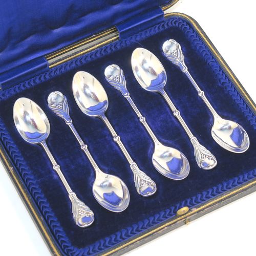 A very pretty Antique Edwardian Sterling Silver set of six tea or coffee spoons, in an Art Nouveau style with hand-chased floral decoration, and having plain oval bowls, all in their original dark blue satin and velvet-lined presentation box. These beautiful antique silver spoons were made by Joseph Rogers of Sheffield in 1907. The dimensions of this fine hand-made set of silver teaspoons or coffee spoons are length of each spoon 11 cms (4.25 inches), and the total weight is approx. 88g (2.8 troy ounces).   