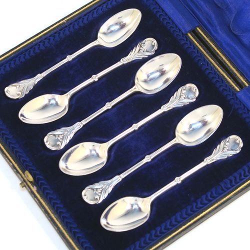 A very pretty Antique Edwardian Sterling Silver set of six tea or coffee spoons, in an Art Nouveau style with hand-chased floral decoration, and having plain oval bowls, all in their original dark blue satin and velvet-lined presentation box. These beautiful antique silver spoons were made by Joseph Rogers of Sheffield in 1907. The dimensions of this fine hand-made set of silver teaspoons or coffee spoons are length of each spoon 11 cms (4.25 inches), and the total weight is approx. 88g (2.8 troy ounces).   