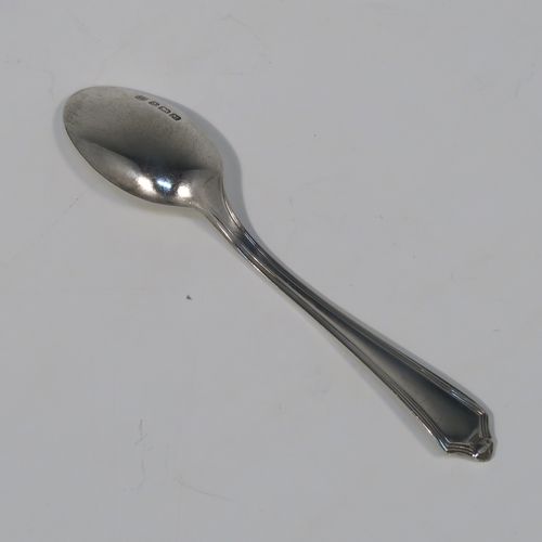 An elegant Art Deco style Sterling Silver set of twelve teaspoons or coffee spoons, having plain oval bowls, and handles with a single-struck reeded Pembury style pattern, all in their original cream satin and black velvet-lined presentation box. These pretty silver spoons were made by the Barker Brothers of Sheffield in 1936. The dimensions of this fine hand-made Art Deco set of sterling silver coffee spoons or teaspoons are length of each spoon 11 cms (4.3 inches), and the total weight is approx. 132g (4.3 troy ounce).   