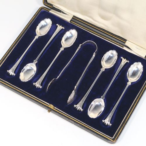 A very pretty Antique Victorian Sterling Silver set of six teaspoons and sugar nips in the Onslow pattern, having unusual oval bowls with lobed decoration and fluting on the reverse, all in their original cream satin and dark blue velvet-lined presentation box. These beautiful silver teaspoons and sugar nips were made by Charles Stuart Harris of London in 1894. The dimensions of this fine hand-made set of teaspoons are length of each spoon 11 cms (4.25 inches), and the total weight is approx. 93g (3 troy ounce).  