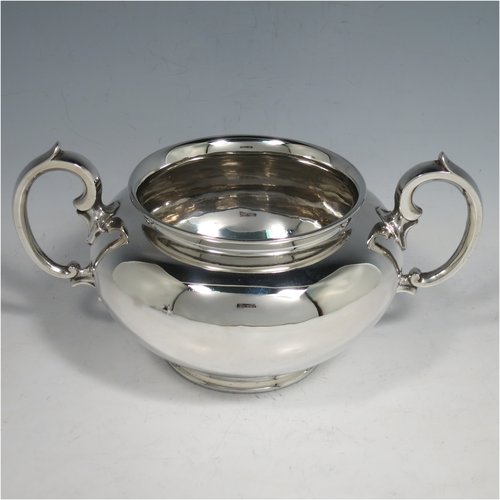 An Antique Victorian Sterling Silver three-piece  tea set, consisting of a teapot, sugar bowl and cream jug. The bodies in a plain round style with scroll handles, the teapot with silver handle and finial, and all sitting on collet feet. Made by the Barnard Brothers of London in 1847. The dimensions of this fine hand-made antique silver tea service are length of teapot 26 cms (10.25 inches), height 13.5 cms (5.25 inches), and it weighs a total of approx. 1,101g (35.5 troy ounces).   