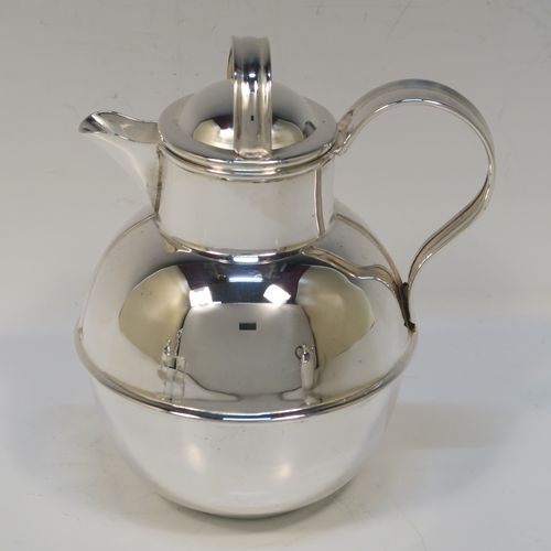 A very stylish and unusual Antique Edwardian Silver-Plated four-piece tea set in a Guernsey style, consisting of teapot, hot-water pot, sugar bowl, and cream jug, all in their original wire-work carrying stand. This beautiful antique silver plated tea set was made by James Collyer of Sheffield in ca. 1910. The dimensions of this fine hand-made antique silver-plated Guernsey tea set and carrying frame are height 21 cms (8.25 inches), length 26.5 cms (10.5 inches), and width 18 cms (7 inches).   