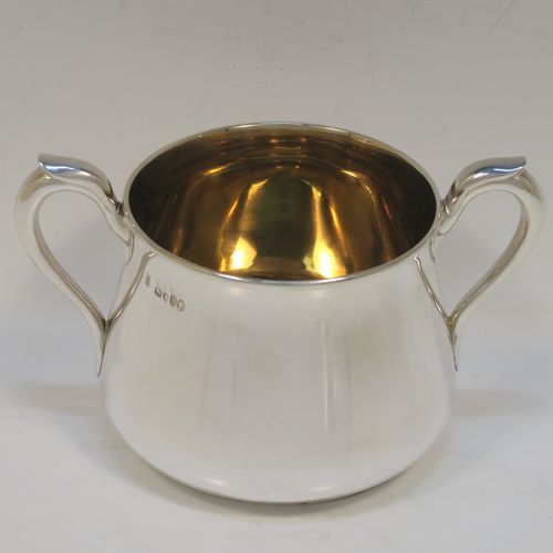 A very handsome Antique Victorian Sterling Silver three-piece tea set, consisting of a teapot, sugar bowl and cream jug. The bodies in a plain round bellied style with scroll handles, the teapot with a flat topped hinged lid and a silver handle and finial, the sugar bowl and cream jug with gold-gilt interiors, and all sitting on flat bases. This elegant silver tea set was made by Hunt and Roskell of London in 1878. The dimensions of this fine hand-made antique silver tea service are length of teapot 20 cms (8 inches), height 12.5 cms (5 inches), and it weighs a total of approx. 950g (31 troy ounces).  