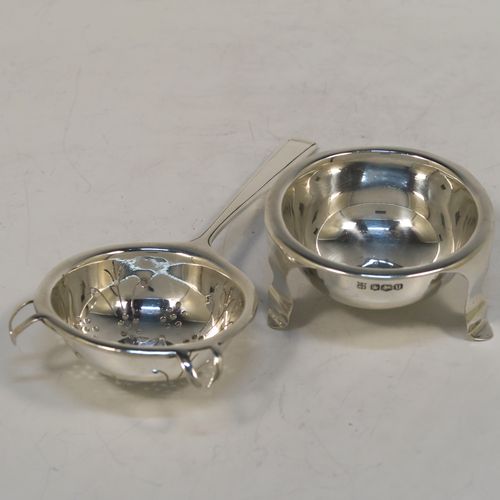 A very elegant Sterling Silver tea strainer and bowl in an Art Deco style, having an Athenian pattern handle, a round hand-pierced bowl with two side holder lugs, and sitting on a plain round dregs bowl with three flange feet. This handsome Art Deco silver tea strainer was made by Cooper Brothers of Sheffield in 1937. The dimensions of this fine hand-made silver tea strainer & bowl are length 15 cms (6 inches), diameter of bowl 6.5 cms (2.5 inches), with a total weight of approx. 98g (3.2 troy ounces).  