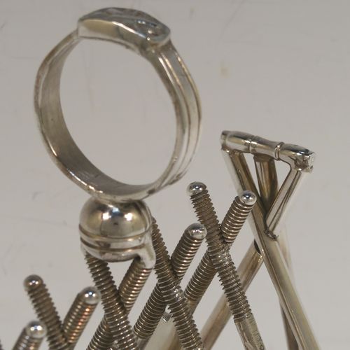 A very unusual Antique Victorian Silver-Plated seven-bar toast-rack, having crossed cricket bats with wickets and bails, and sitting on a rounded rectangular base with four cricket ball feet, and a round loop handle. This beautiful and rare Cricket designed toastrack was made by Padley, Parkin and Co., of Sheffield in ca. 1880. The dimensions of this fine hand-made antique silver plated cricket toast-rack are length 18 cms (7 inches), height 16 cms (6.3 inches), and width 8 cms (3.25 inches).  