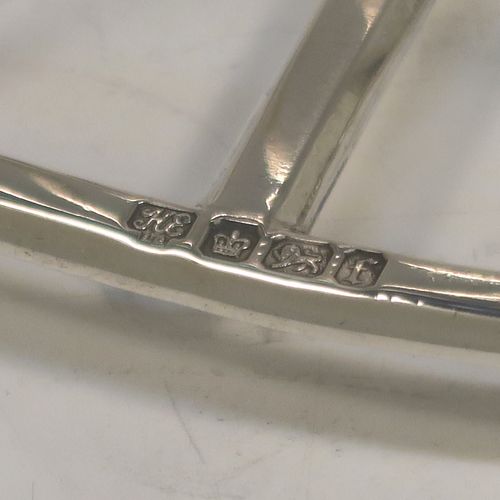 A very handsome Antique Victorian Sterling Silver seven-bar toastrack, having plain arched cross-section wire-work bars, a matching loop handle, all sitting on a rectangular base with a strengthening strut, on four cast panelled feet. This elegant antique silver toast-rack was made by Hawksworth Eyre and Co. Ltd., of Sheffield in 1898. The dimensions of this fine hand-made antique silver toast-rack are length 13 cms (5 inches), height 11.5 cms (4.5 inches), width 6.5 cms (2.5 inches), and it weighs approx. 191g (6.2 troy ounces).   