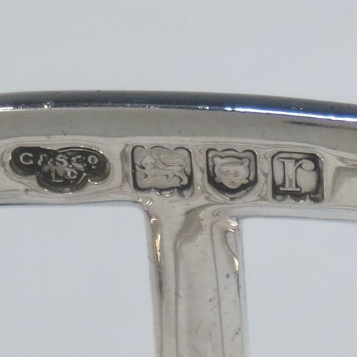 A handsome Antique Sterling Silver five-bar toastrack, having plain square cross-section wire-work bars, a matching loop handle, all sitting on a rectangular base with a strengthening strut, on four cast panelled feet. Made by Goldsmiths & Silversmiths of London in 1912. The dimensions of this fine hand-made antique silver toast-rack are length 11.5 cms (4.5 inches), height 11.5 cms (4.5 inches), width 6.5 cms (2.5 inches), and it weighs approx. 191g (6.2 troy ounces).  