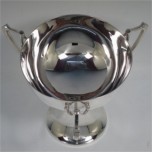 A very handsome Sterling Silver Art Nouveau three-handled trophy cup, having a plain round body, with three handles, and sitting on a pedestal foot. Made by the Adie Brothers of Birmingham in 1922. The dimensions of this fine hand-made sterling silver Art Nouveau trophy cup are height 17 cms (6.5 inches), diameter of main body 15 cms (6 inches), and it weighs approx. 765g (22.7 troy ounces).    