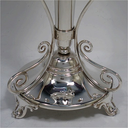 A very pretty and unusual pair of Antique Edwardian Sterling Silver Art Nouveau style vases, having removable central bodies, sitting in a frame with wire-work scrolls, attached to round bases with three scroll feet. Made by Walker and Hall of Sheffield in 1907. The dimensions of this fine pair of hand-made antique silver Art Nouveau vases are height 24 cms (9.5 inches), and diameter at bases 11 cms (4.3 inches). Please note that these vases are not loaded, and the total weight of silver is 640g (20.6 troy ounces)..    