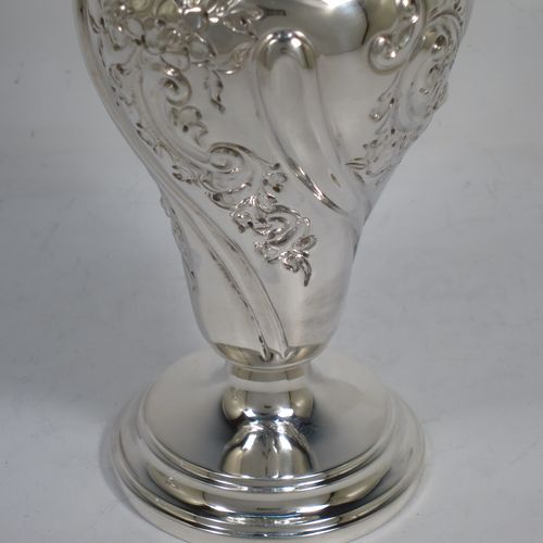 A very pretty pair of Antique Victorian Sterling Silver Art Nouveau style vases, having hand-chased floral and scroll decoration, with hand-pierced upper necks and applied scroll borders, and all  sitting on round stepped pedestal feet. Made by Walter and Charles Sissons of London in 1900. The dimensions of this fine pair of hand-made antique silver Art Nouveau vases are height 17 cms (6.75 inches), and diameter at top 7 cms (2.75 inches). Please note that these vases are not loaded, and the total weight of silver is 422g (13.6 troy ounces).    