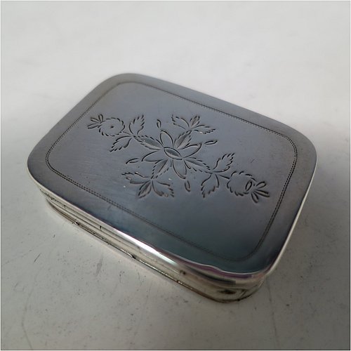 An Antique Georgian Sterling Silver vinaigrette, having hand-engraved greek-key decoration on the top and hand-engraved floral decoration on the base, a gold-gilt interior, and a plain hand-pierced grill. Made by John Shaw of Birmingham in 1803. The dimensions of this fine hand-made antique silver vinaigrette are length 3.5 cms (1.3 inch), width 2.2 cm (1 inch), and depth 0.8 cm (0.3 inches).   