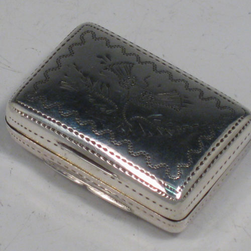    Antique Georgian sterling silver vinaigrette, having a rectangular body with hand-engraved floral decoration and a vacant cartouche, a hinged lid, a gold-gilt interior with hinged hand-chased grill. Made by Francis Clark, of Birmingham in 1834. The dimensions of this fine hand-made silver vinaigrette are length 3 cms (1.25 inches), and width 2 cms (0.75 inches).   