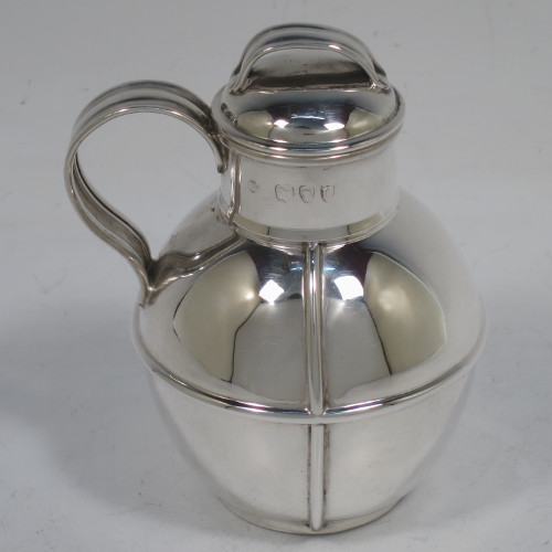 A small but handsome and unusual Antique Victorian Sterling Silver Guernsey style water / milk jug for one person, having a plain round bellied body with applied reeded girdles, a scroll handle, a pull-off lid, and all sitting on a flat base. Made by the Barnard Brothers of London in 1895. The dimensions of this fine hand-made antique silver Guernsey jug are height 9.5 cms (3.75 inches), diameter of body 7 cms (2.75 inches), and it weighs approx. 90g (3 troy ounces).   