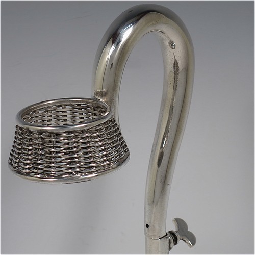 An Antique Victorian Silver Plated wine bottle cradle or holder, having a round straight-sided base with basket-weave hand-pierced decoration, a plain sliding scroll handle with matching basket weave neck and retaining screw. Made by J. and B. of Sheffield in ca. 1870. The dimensions of this fine hand-made antique silver-plated wine bottle holder or cradle are height 26 cms (10 inches), or 33 cms (13 inches) extended, and diameter of base 11.5 cms (4.5 inches). Please note that this wine bottle cradle or holder will accept a 75cl bottle, (bottle shown for display purposes only).   