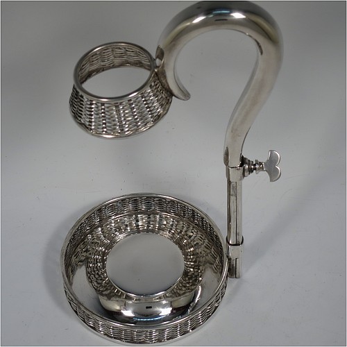 An Antique Victorian Silver Plated wine bottle cradle or holder, having a round straight-sided base with basket-weave hand-pierced decoration, a plain sliding scroll handle with matching basket weave neck and retaining screw. Made by J. and B. of Sheffield in ca. 1870. The dimensions of this fine hand-made antique silver-plated wine bottle holder or cradle are height 26 cms (10 inches), or 33 cms (13 inches) extended, and diameter of base 11.5 cms (4.5 inches). Please note that this wine bottle cradle or holder will accept a 75cl bottle, (bottle shown for display purposes only).   