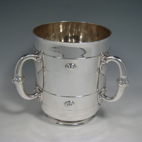    Antique Victorian sterling silver Arts and Crafts wine cooler, having a plain round body with three three handles and medieval style decoration. Made by J.B. Carrington of London in 1880. Height 18.5 cms (7.25 inches), diameter 15 cms (6 inches). Weight approx. 1,375g (44 troy ounces).