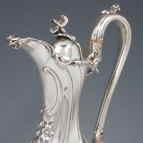    Antique Victorian sterling silver hand-chased wine ewer made by Charles Reilly & George Storer of London in 1845. Height 33 cms, width 13.5 cms. Weight 29 troy ounces.