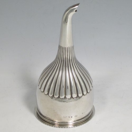 Antique Georgian sterling silver wine decanting funnel, having a round body with hand-chased half-fluted decoration, and a pull out strainer with a shell clip and gadroon border. Made by Alexander Field of London in 1816. The dimensions of this fine hand-made silver wine decanting funnel are height 15 cms (6 inches), diameter of cup 8.5 cms (3.25 inches), and it weighs approx. 117g (3.7 troy ounces).   