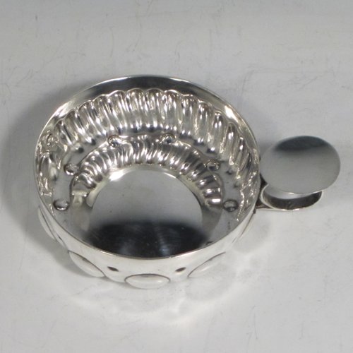 Antique Victorian Silver wine taster, having a round body, with hand-chased swirl-fluted decoration and punched bead-work, a loop handle with thumb-piece, and sitting on a concave base. Made in Paris, France ca. 1890, with a Minerva 2nd Quality mark, indicating 800 standard silver. The dimensions of this fine hand-made silver wine taster testavine are diameter 8 cms (3 inches), and height 2.5 cms (1 inch), and it weighs approx. 105g (3.4 troy ounces).