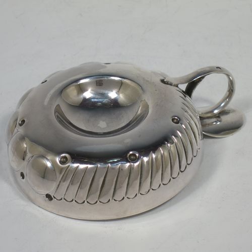 A very pretty Antique Victorian Silver wine taster, having a round body, with hand-chased fluted and ball decoration, a loop handle with thumb-piece, and sitting on a base with convex center. Made in Paris, France ca. 1890, with a Minerva 1st Quality mark, indicating 950 standard silver. The dimensions of this fine hand-made antique silver wine taster testavine are diameter 9 cms (3.5 inches), height 3.5 cms (1.3 inch), and it weighs approx. 110g (3.5 troy ounces).    